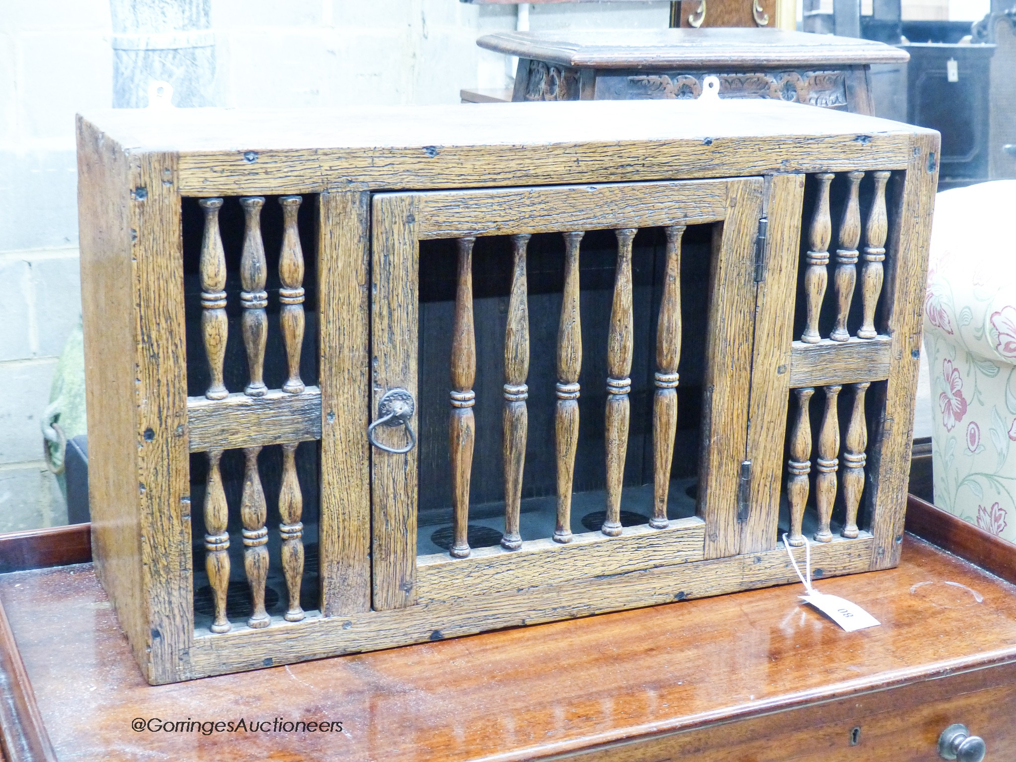 A 17th century style oak hanging food cupboard